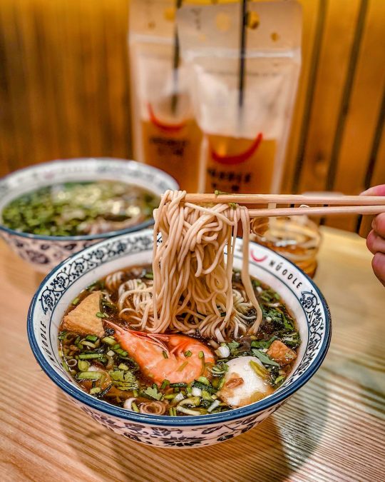 a bowl of seafood hand-pulled noodles soup