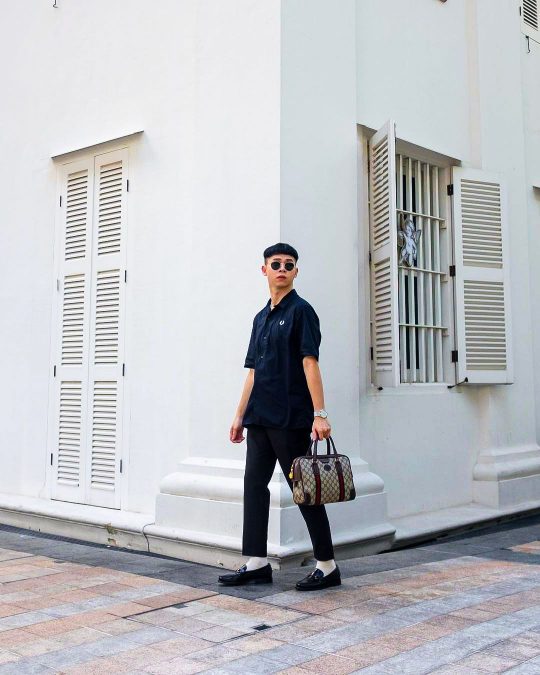 a fashionably dressed person along Bugis street