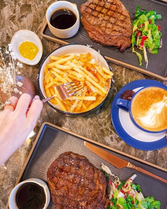 a table full of delicious steak and fries from Perch