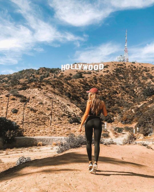 a person admiring the iconic Hollywood sign in Los Angeles, California