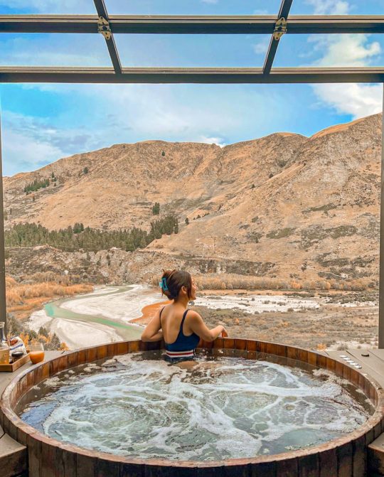 take a dip in the Onsen Hot Springs with a view of the Shotover River below