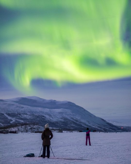 watch the dancing of aurora borealis in the sky of Abisko National Park, Sweden