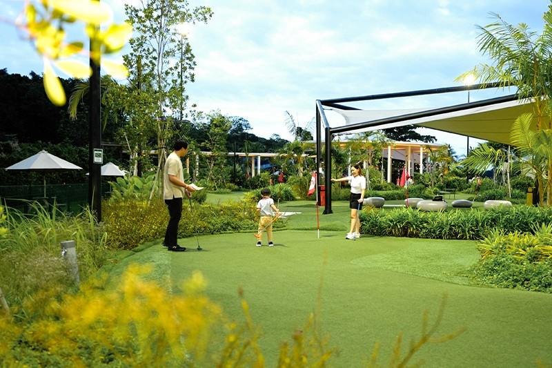 family enjoying a game of golf at UltraGolf at the Palawan