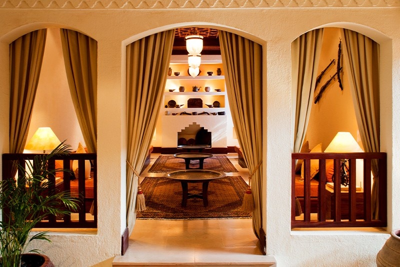 interior of the Al Maha Desert Resort and Spa room with luxe furnishings