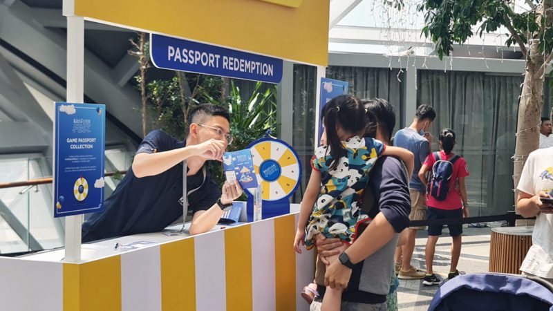 visitors at the passport redemption booth